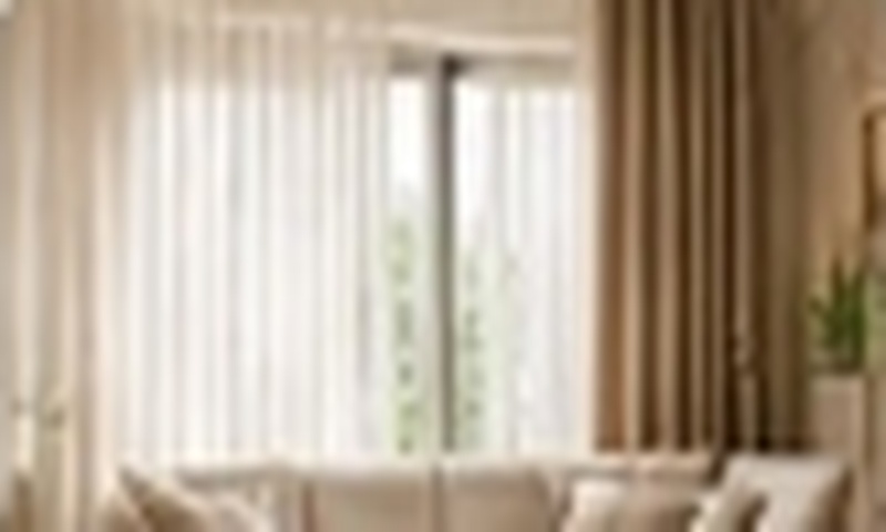 Living room styled with elegant floor-to-ceiling drapery and sheer curtains
